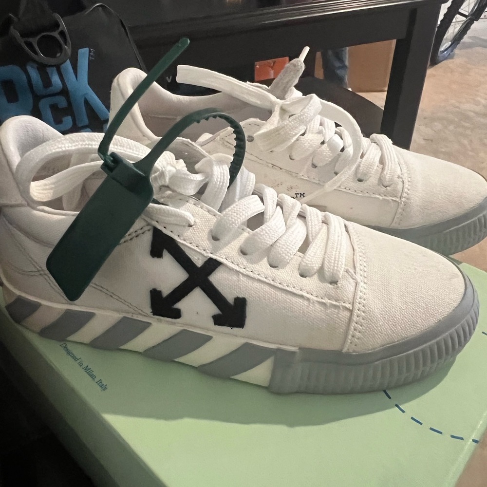 Off white canvas low top sneakers